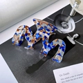 Blue marble acetate hair claw clip with zig-zag wave design on a fashion magazine - M-Shaped Chocolate Blue / 9cm