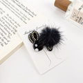 Elegant black plush rabbit hair clip with gold beads and white faux pearls on display - Black / 4.5CM