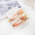 Set of two cute cat-shaped acetate hair clips with vibrant watercolor marble patterns - Iridescent Red