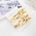 Cute acetate cat hair clips set in tortoiseshell brown pattern on display card - Patterned Yellow
