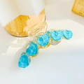 Pastel sky blue heart hair claw clip with water wave texture on a yellow resin base - Crystal Heart Blue Style