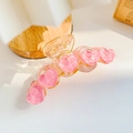 Pink heart resin hair claw clip with amber translucent finish and spring detail - Crystal Heart Pink Style