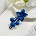 Matte dark blue floral hair claw clip with frosted finish on elegant white tray - Blue