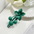 Elegant dark green matte flower hair claw clip on a white ceramic plate decoration - Green