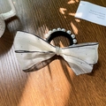 Elegant white tulle bow hair tie with pearl details and rhinestones on a dark wood background - 5cm / Beige Bowknot