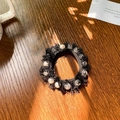 Elegant black lace hair scrunchie with faux pearls and fringe on a dark wood table - 7cm / Lace Pearl