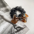 Chic black tulle hair scrunchie featuring a large tortoiseshell patterned acetate bow detail - 8cm / Blue Brown