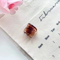 Mini amber resin hair claw clip with silver spring on beige linen background - Basic Claw Style / Caramel color