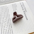 Minimalist matte dark brown triangle hair claw clip on an open vintage book page - Type A Brown 4cm