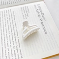 Minimalist white matte triangular hair claw clip for high ponytail styling on French book background - Type A White 4cm