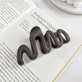 Minimalist matte dark coffee hair claw clip with a wavy geometric design on a book - Dark Brown 10.5CM
