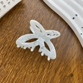 Elegant small acetate butterfly hair claw clip with white marble pattern on wood - Ocean Wave White