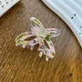 Pink and green marbled acetate butterfly hair claw clip for women on a wooden background - Jelly Pink Green