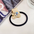 Elastic black hair tie with cream resin bear featuring a heart-shaped crystal detail - Milk Coffee