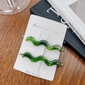 Elegant green wavy acetate hair clips set with gold logo detail and metal accents - 7cm / Dark Green