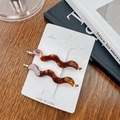 Set of two wavy brown tortoiseshell acetate hair clips with elegant gold logo lettering - 7cm / Leopard Brown