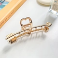 Golden liquid metal hair claw clip in cupid arrow heart shape with sparkling zircon accents - Arrow Through Heart Bright Gold