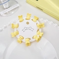 10-teiliges Set cremegelbe Mini-Hasen-Haarklammern mit mattem Finish auf Displaykarte - Kaninchen / Blassgelb