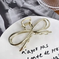 Elegant liquid metal hair claw clip in glossy gold finish with minimalist line design - Gold Bowknot