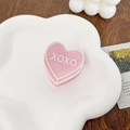 Pink heart-shaped acrylic hair claw clip with white XOXO text in a stylish design - Pink 4CM