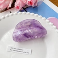 Elegant purple marble acetate hair claw clip with semi-circular design on white ceramic plate - 8cm / Lavender