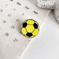 Small acetate hair claw clip featuring a yellow and black soccer ball sports design - Yellow Football