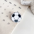 Small soccer ball hair claw clip with black and white pattern for athletic hairstyles - Football