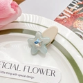 Molletta a stella in acetato azzurro con strass centrale su base beige - Blu da Sogno (5CM)