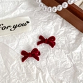 Pair of elegant dark red velvet bow hair clips with pearls on a white textured background - Mini Bow Wine Red