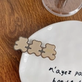 Three brown bear hair clips made of acrylic with French gold lettering on a white plate - Bear-Coffee