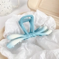 Bow-shaped metal hair claw clip featuring a soft blue and white gradient matte finish - Sky Blue