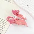 Pink gradient butterfly hair claw clip with faux pearl detail on vintage book page - Pearl Fuchsia