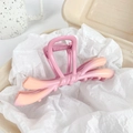 Matte pink-orange gradient butterfly hair claw clip with a large metal spring design - Pink