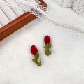 Pair of red flocked tulip hair clips with green leaves and rhinestones on plush background - Tulip Rhinestone 5cm