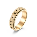 Golden spinner ring with moon and stars featuring a frosted sandblast texture - US 5 / Gold