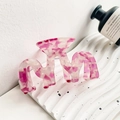 Pink marble textured hair claw clip on a decorative tray for elegant hair styling - Crystal Purple Mountain Style 8.7cm