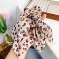 Floral bow scrunchie with beige fabric and blue abstract leopard print details - Brown Flower