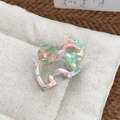 Bunte Haarklammer aus Acetat in künstlerischer Figurenform mit mehrfarbigem Marmoreffekt - Rosa und Grün