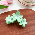Three green floral hair claws with smooth matte finish for stylish summer hairstyles - Green 9.5cm