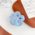 Iridescent light blue frangipani hair claw clip with golden spring on wooden tray - Sky Blue 7.8cm
