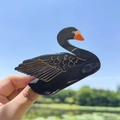 Elegant black swan hair claw clip with golden wing patterns and glossy finish - Black Swan