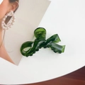 Translucent dark green acetate hair claw clip in an elegant ribbon bow design - Small / Green