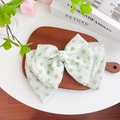 Elegant oversized chiffon bow hair tie with green polka dots and pearl accents - Pearl Bowknot