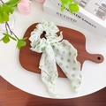 White and green polka dot chiffon scrunchie with long ribbons on wooden surface - Single Layer Ribbon