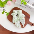 White chiffon scrunchie with green polka dots, silk bow, and faux pearl detail - Ribbon Scrunchie