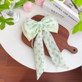 Light green polka dot organza bow hair tie with a white pearl and long ribbons - Ribbon Bow