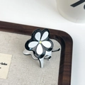 Elegant black and white clover acetate hair claw with a sparkling central rhinestone - White