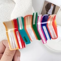 Kleurrijke geometrische haarklem in boekstijl met levendig meerkleurig acetaatdesign - Oranje