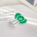 Creative acetate cabbage hair clip in vibrant green and white with a glossy finish - Cabbage