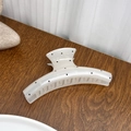 Minimalist large hair claw clip in creamy white finish with classic black polka dots - White Crescent Style